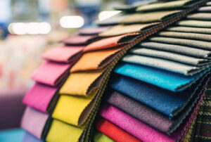Colorful upholstery fabric samples in a furniture store.